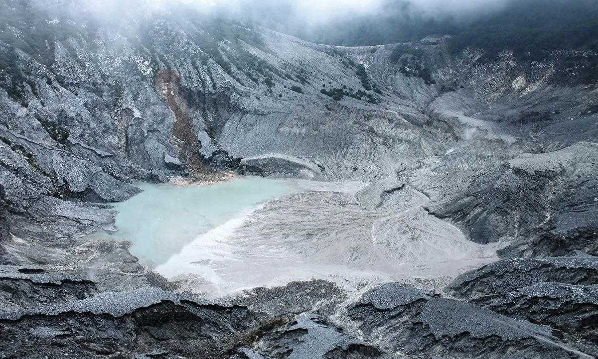 Kelimutu multi-colored volcanic crater lakes at sunrise, Flores Indonesia