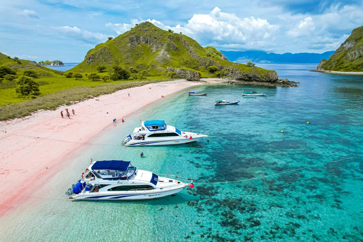 Traditional outrigger boat on turquoise water, Riung 17 Islands Flores
